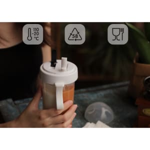 A drink bottle with a compartmentalised design, featuring a double straw and a white lid. It has a logo.