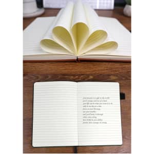 A notebook with eco-friendly coffee grounds pages, featuring a brown cover and lined pages, open to show inside.