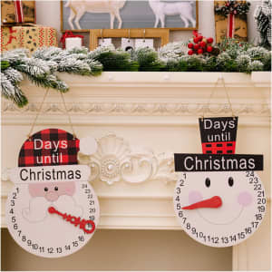 Two decorative Christmas countdown ornaments on a mantel, featuring a Santa and a snowman, both in red and white.
