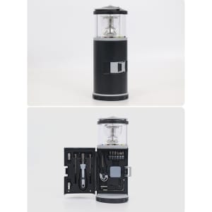 A black LED lantern with a clear top, featuring an integrated tool set inside. It includes various tools and accessories.