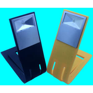 A foldable book light in black and yellow, featuring a rectangular light at the top and a sturdy base.