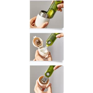 A drink bottle brush in green, designed for cleaning, alongside a white bottle with a removable cap.