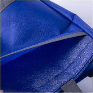 A blue lunch cooler tote with a grey lining and an open zipper revealing the interior compartment.