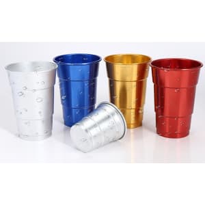 A set of rolled edge aluminium cups in silver, blue, gold, red, and one tilted, featuring water droplets.