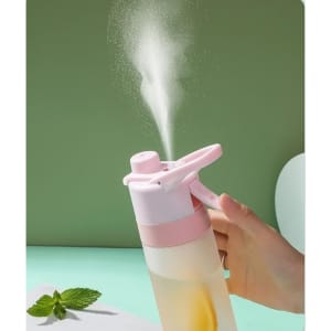 A drink bottle in pink and clear, featuring a spray nozzle releasing a fine mist. It includes a branding logo.
