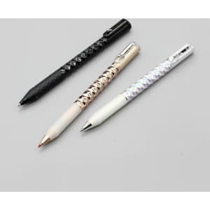 A collection of three Crinkle Grip Pens in black, silver, and white, featuring textured grips and a logo.