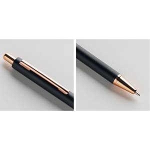 A metal push-up pen in black with a rose gold clip and tip, featuring a textured grip and branding.