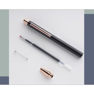A black and rose gold metal push-up pen with a removable nib and a spring.