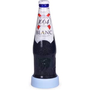 A drink bottle with a blue base, showcasing a frosty beverage inside, resting on a light blue coaster.