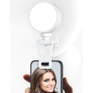 A white conferencing lighting kit with a circular light attached to a phone holder, designed for enhanced lighting.