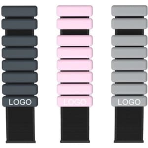 A collection of silicone weighted bracelets in black, pink, and grey, each displaying a logo.