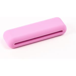 A pink silicone weighted bracelet with a smooth surface and a slot running through the centre.