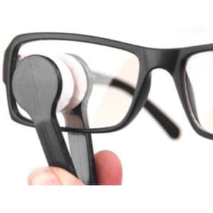 A black eye glass cleaner with a handle and cleaning pads, used for cleaning lenses.