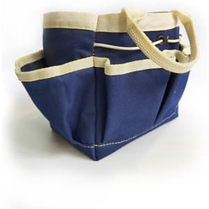 A navy blue garden tote with cream handles and pockets for storage, featuring a sturdy design.