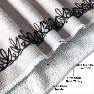 A beach towel featuring a solid colour design, with a decorative trim and a firm seam. It is soft and skin-friendly.