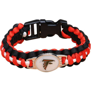 A flag pattern paracord bracelet in red, black, and white, featuring a logo and a whistle attachment.