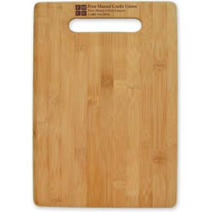A large bamboo cutting board with a handle cutout, featuring a smooth surface and natural wood grain.