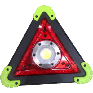 A triangular warning lamp in red and black with green rubber corners, featuring a central light. Contains a logo.