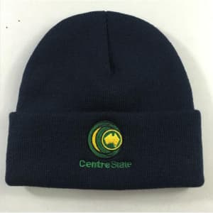 A navy blue knitted beanie hat with a cuff and an embroidered logo.