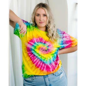 A tie-dye adult T-shirt in vibrant yellow, pink, green, and blue patterns, featuring a heart design.