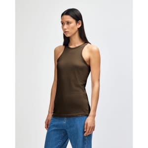 A fitted olive green women's racerneck tank top with a logo, styled with light denim shorts.