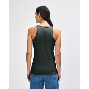 A green women's racerneck tank top with a fitted style and a logo on the back, paired with casual denim bottoms.