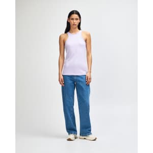 A lilac women's racerneck tank top paired with loose blue jeans, featuring a simple design and no visible logos.