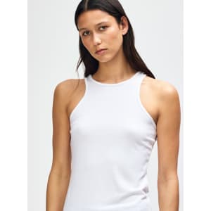 A white women's racerneck tank top featuring a form-fitting design and a logo.