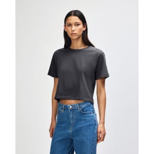 A grey women's boxy T-shirt with a relaxed fit, featuring short sleeves and a simple design.
