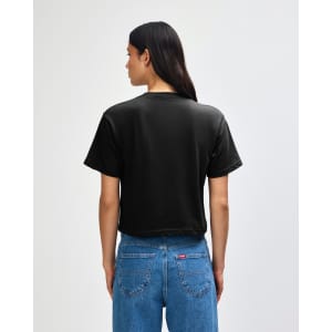 A black women's boxy T-shirt made from fine jersey fabric, featuring a simple back design and short sleeves.