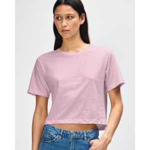 A pink women's fine jersey boxy t-shirt with short sleeves, featuring branding.