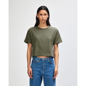 A women's boxy T-shirt in olive green, featuring short sleeves and a relaxed fit, with a branding logo.