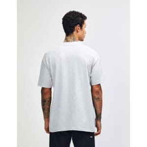 A grey heavyweight cotton unisex T-shirt displayed from the back, worn by a model. The shirt has a simple design.
