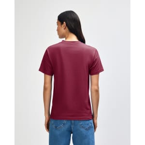 A heavyweight unisex t-shirt in burgundy, featuring a simple design and a visible logo on the back.