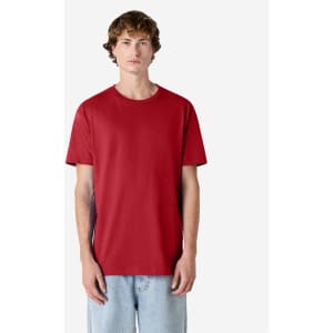 A unisex heavyweight cotton T-shirt in red, featuring a simple design and a relaxed fit.