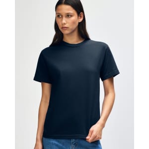 A heavyweight cotton unisex t-shirt in black, displayed on a model. The shirt has a simple design and a logo.