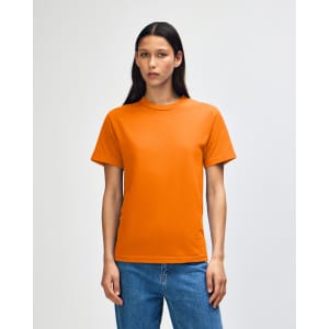 An orange heavyweight cotton unisex T-shirt is displayed, featuring a simple design and a logo.