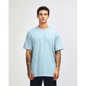 A lightweight, unisex t-shirt in light blue, made from heavyweight cotton, featuring a simple design.