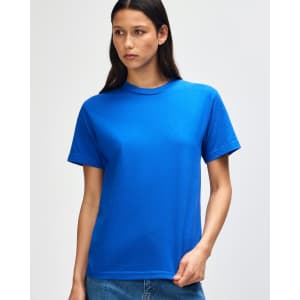 A blue heavyweight cotton unisex T-shirt displayed on a model against a plain background. It has a logo.
