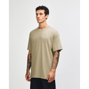 A heavyweight cotton unisex t-shirt in a light beige colour, featuring a crew neck and short sleeves.