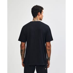 A black unisex heavyweight cotton t-shirt displayed from the back, featuring a simple design and a branding logo.