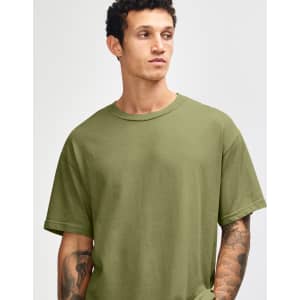 A unisex heavyweight cotton T-shirt in olive green, featuring a relaxed fit and crew neck. Includes branding.