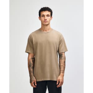 A unisex heavyweight cotton t-shirt in a muted brown colour with a simple design and a logo.
