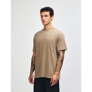 A unisex heavyweight cotton t-shirt in a muted brown colour, featuring a relaxed fit and short sleeves.