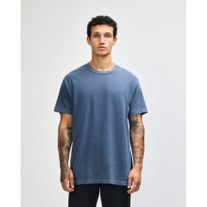 A unisex heavyweight cotton t-shirt in navy blue, featuring short sleeves and a simple design. It has a logo.