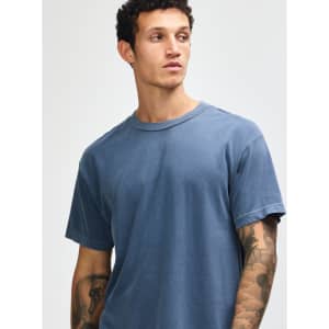 A unisex heavyweight cotton T-shirt in navy, featuring a classic crew neck and short sleeves. It has a logo.