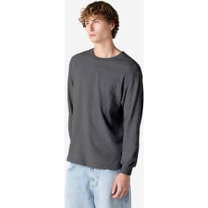 A heavyweight cotton unisex long sleeve T-shirt in grey, featuring a simple design and a logo.