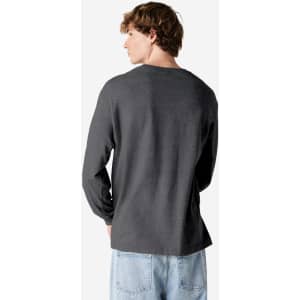 A heavyweight cotton unisex long sleeve t-shirt in dark grey, featuring a relaxed fit and plain back design.