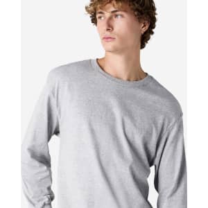 A lightweight, unisex long sleeve T-shirt in grey, featuring a round neckline and a subtle logo.
