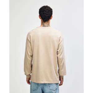 A heavyweight cotton unisex long sleeve T-shirt in beige, featuring a simple design and a branding logo.
